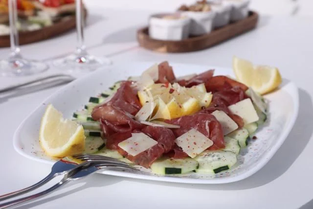 a plate of food aboard LADY A Yacht for Charter