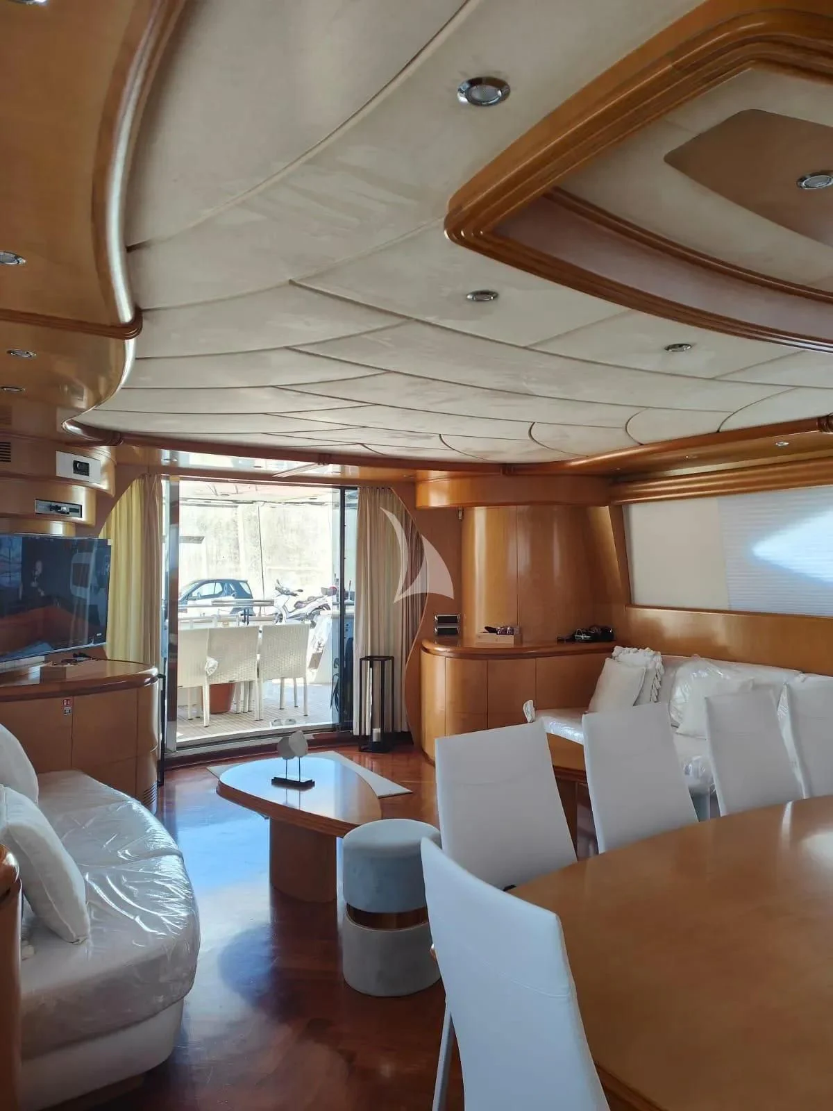 a room with tables and chairs aboard LADY A Yacht for Charter