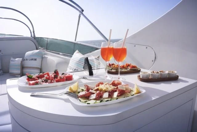 a table with food on it aboard LADY A Yacht for Charter