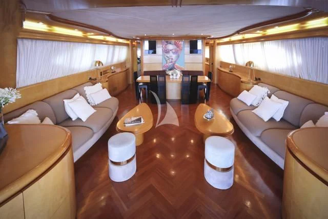 a room with a bed and a table aboard LADY A Yacht for Charter