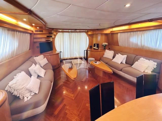 a living room with a couch and a table aboard LADY A Yacht for Charter