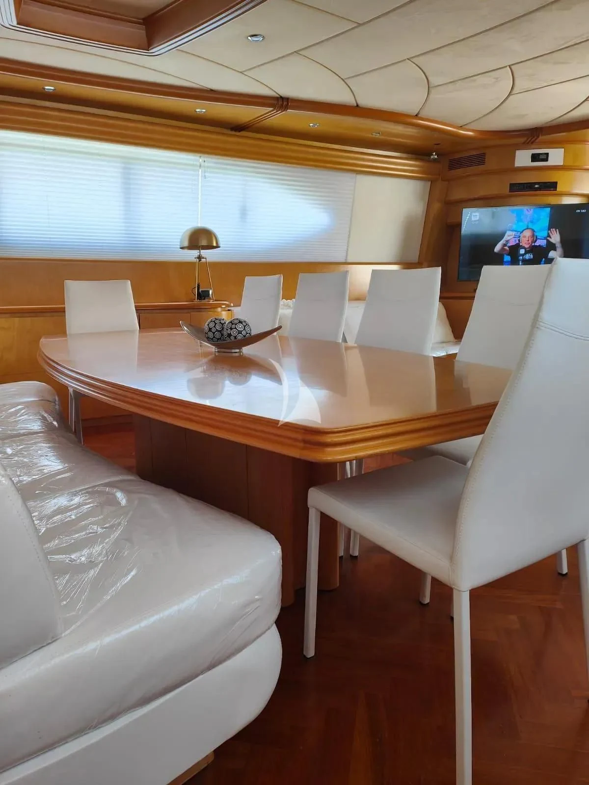 a conference room with a table and chairs aboard LADY A Yacht for Charter
