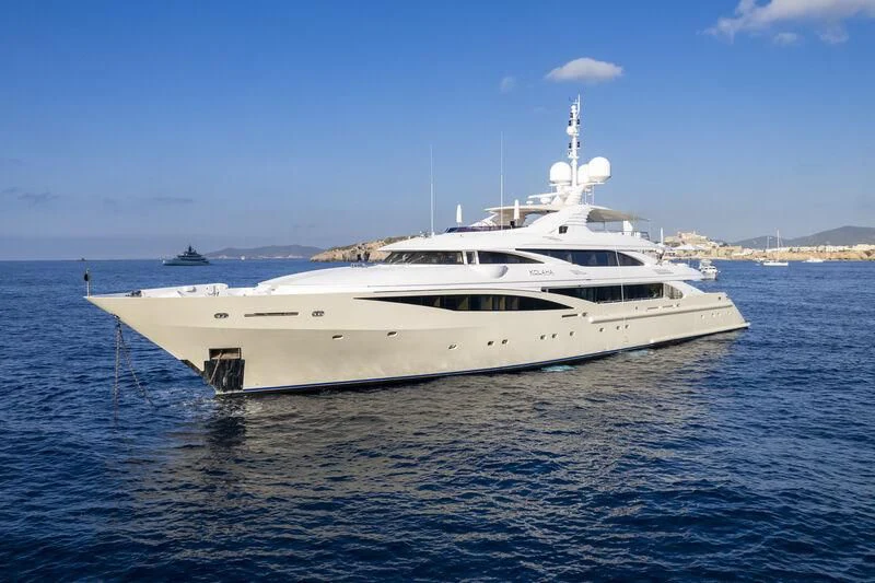 a white yacht in the water aboard KOLAHA Yacht for Sale