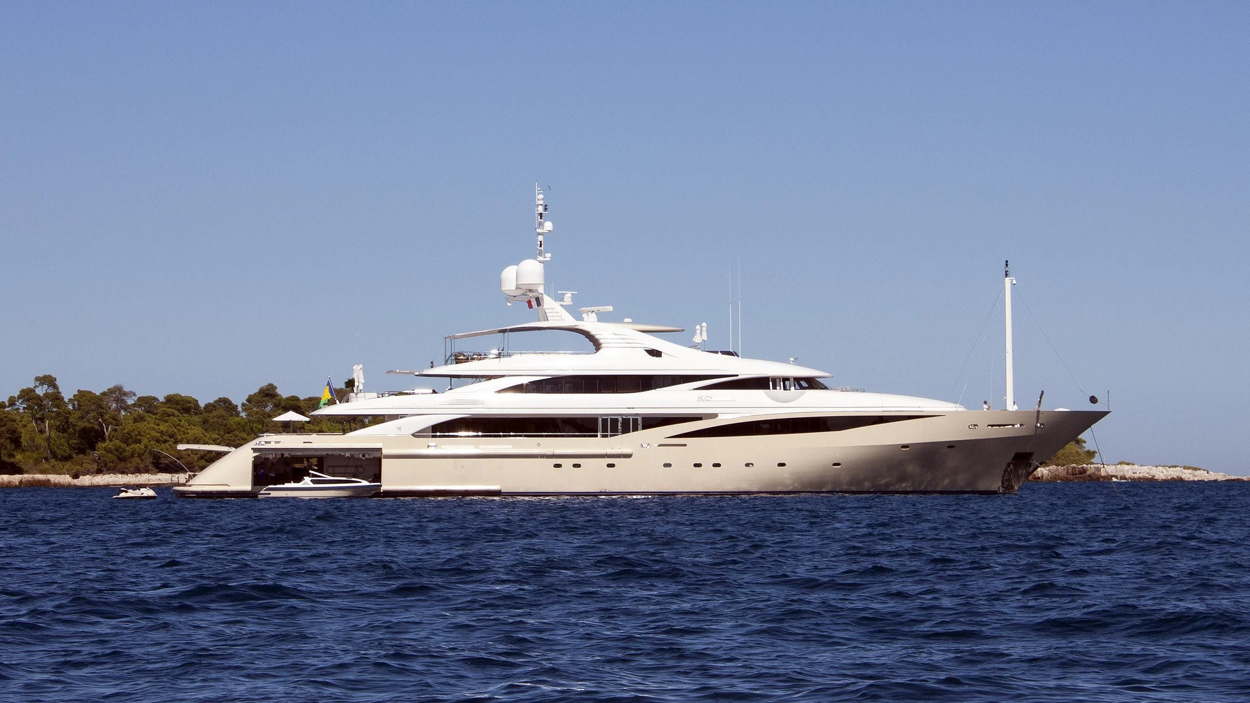a white yacht in the water aboard KOLAHA Yacht for Sale