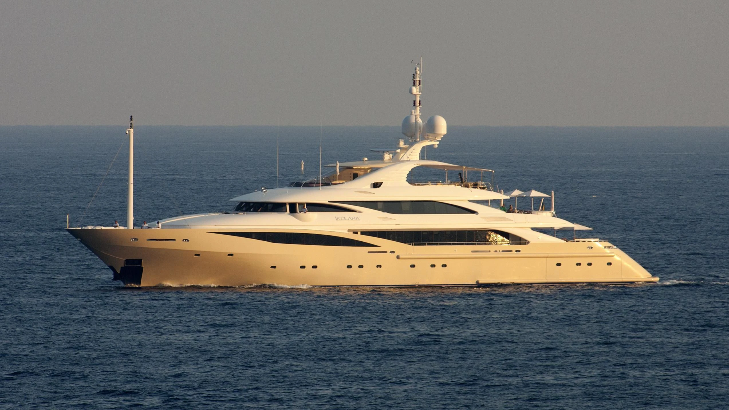 a white yacht in the water aboard KOLAHA Yacht for Sale