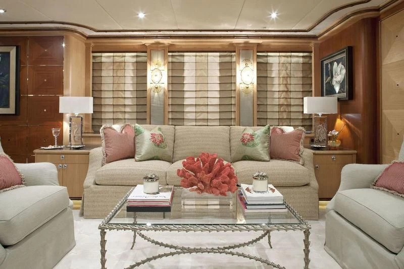 a living room with a couch and a coffee table aboard KOLAHA Yacht for Sale