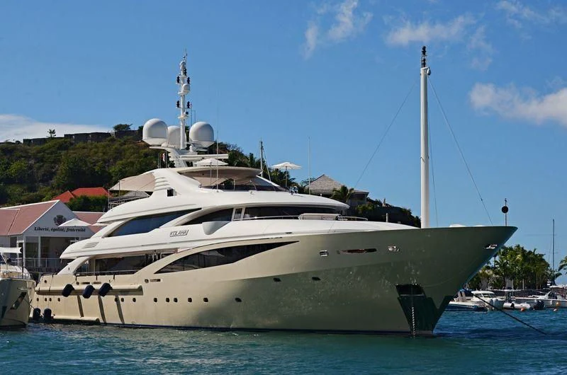 a white yacht in the water aboard KOLAHA Yacht for Sale
