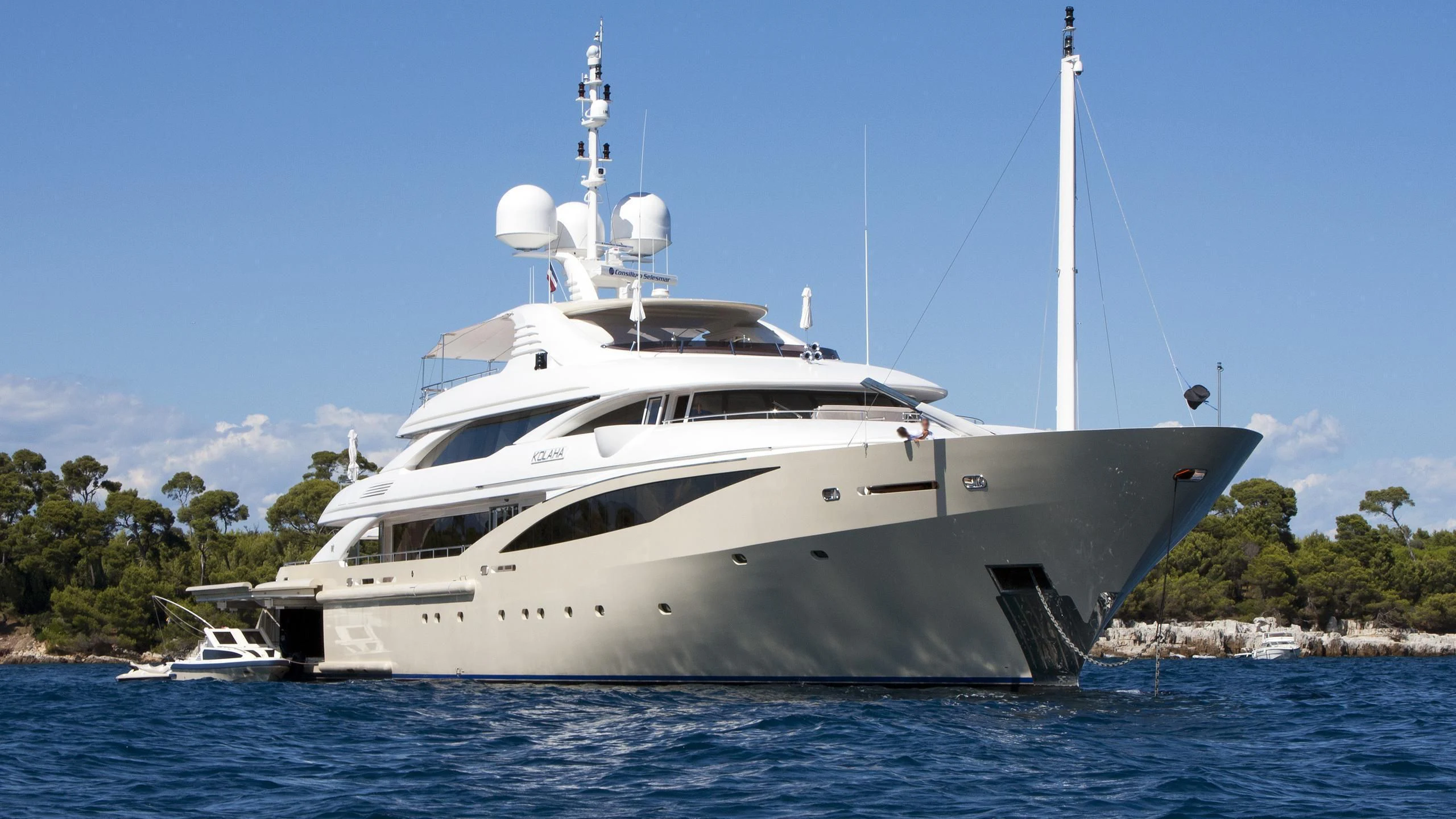 a white boat in the water aboard KOLAHA Yacht for Sale