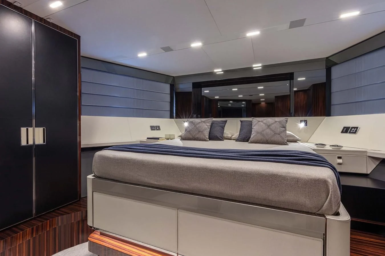 a room with a bed and a desk aboard LISOLO Yacht for Sale