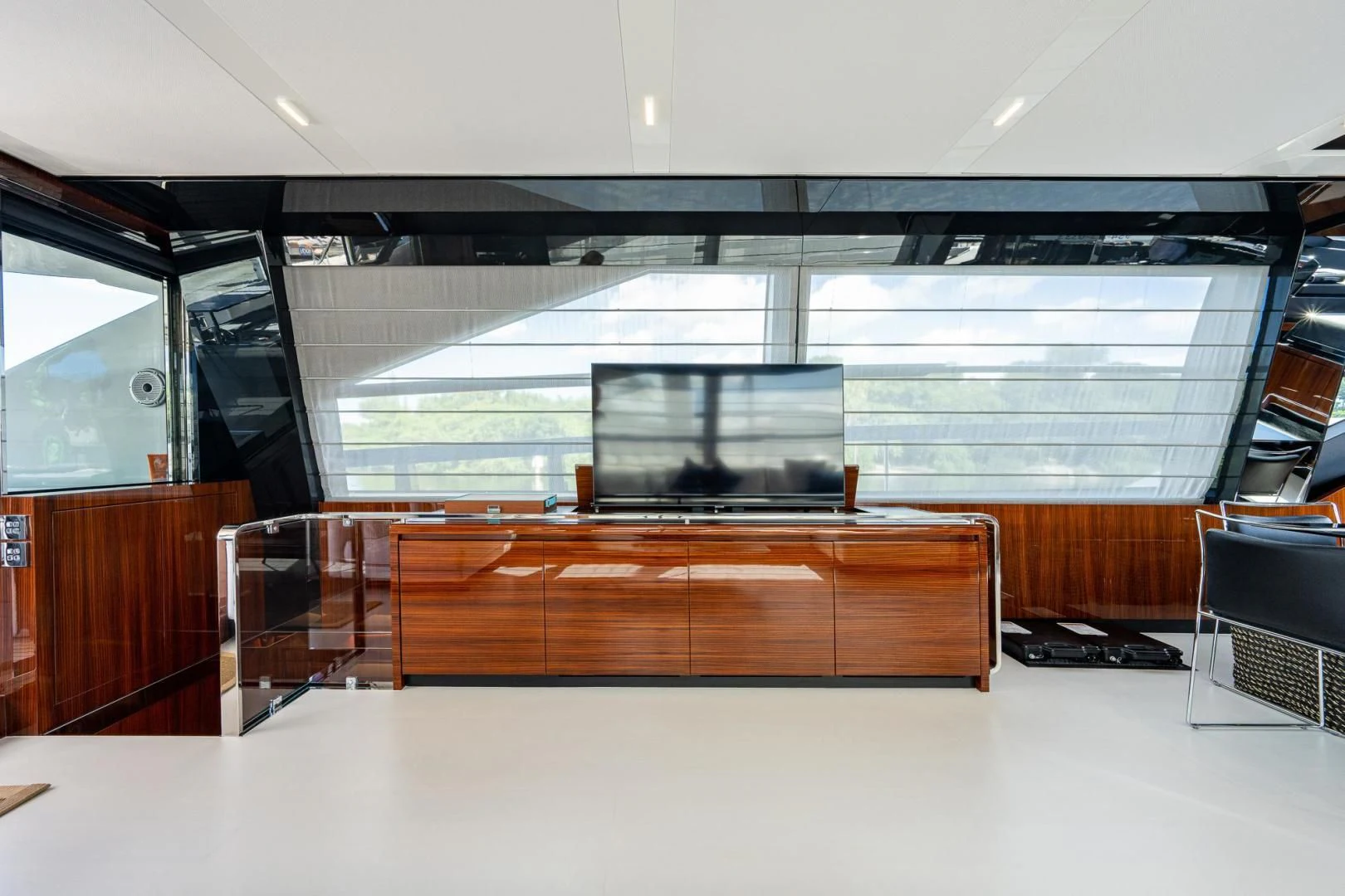 a room with a large window and a desk with a computer on it aboard LISOLO Yacht for Sale