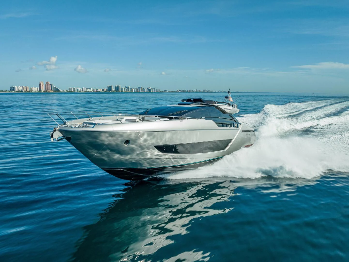 a white boat on water aboard LISOLO Yacht for Sale