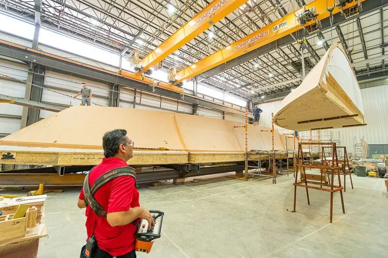 a person standing in a factory aboard HEAVY ACTION Yacht for Sale