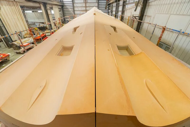 a large white boat in a large building aboard HEAVY ACTION Yacht for Sale