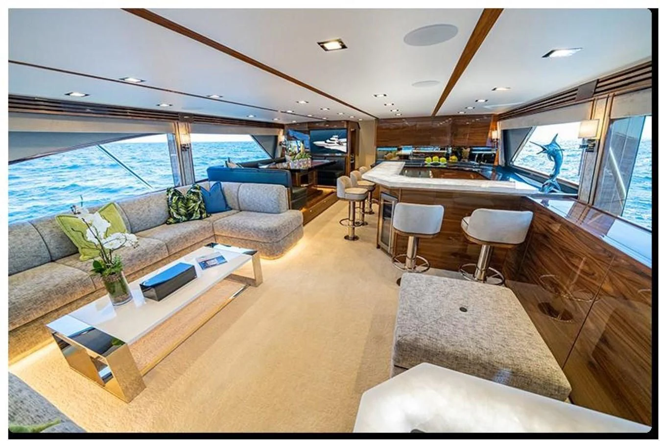 a living room with a large window aboard HEAVY ACTION Yacht for Sale