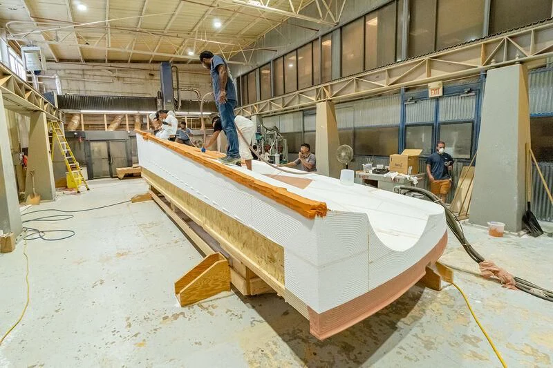 a group of people in a warehouse aboard HEAVY ACTION Yacht for Sale