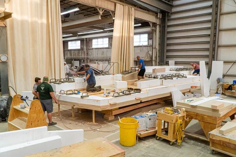 a group of people working in a factory aboard HEAVY ACTION Yacht for Sale