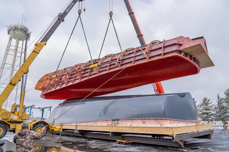 a red and white boat on a dock aboard HEAVY ACTION Yacht for Sale
