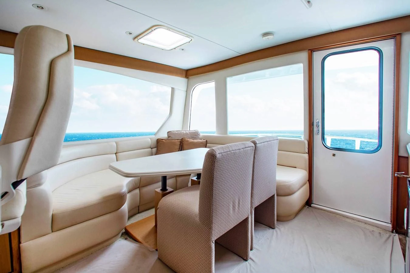 a room with chairs and a table aboard ONE MORE TIME Yacht for Sale