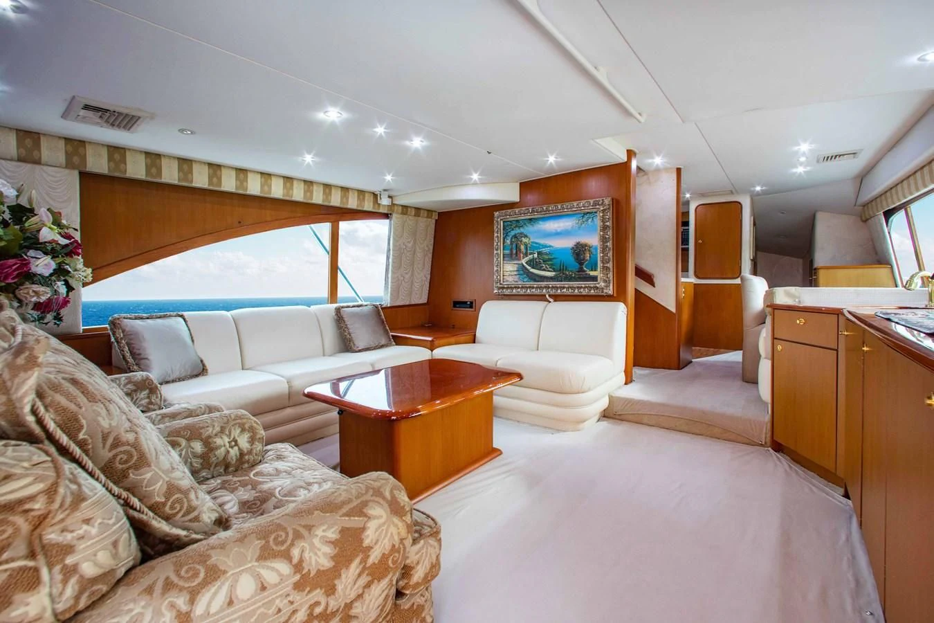 a living room with a couch and a television aboard ONE MORE TIME Yacht for Sale