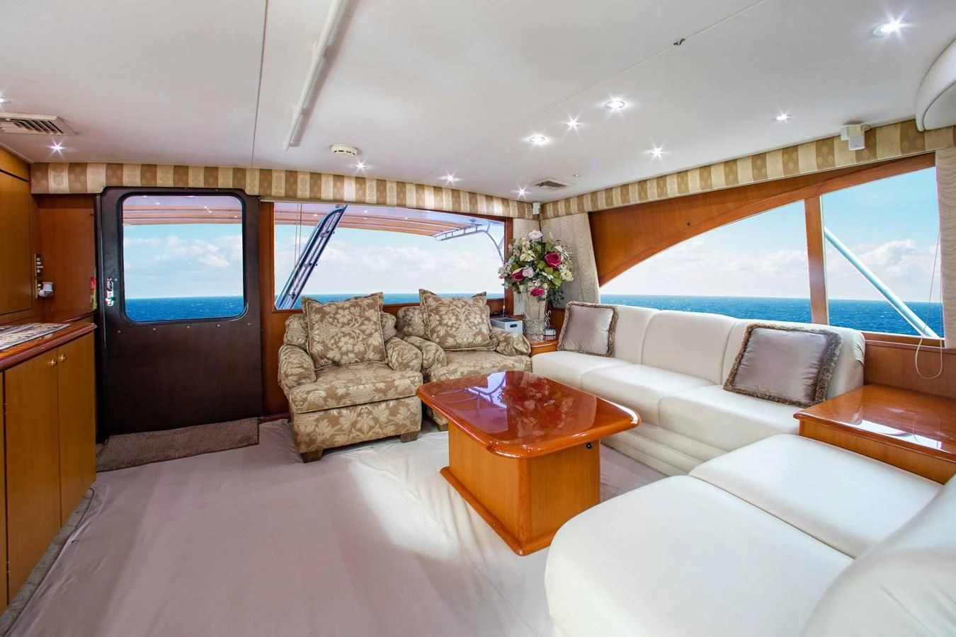 a living room with a couch and a table aboard ONE MORE TIME Yacht for Sale