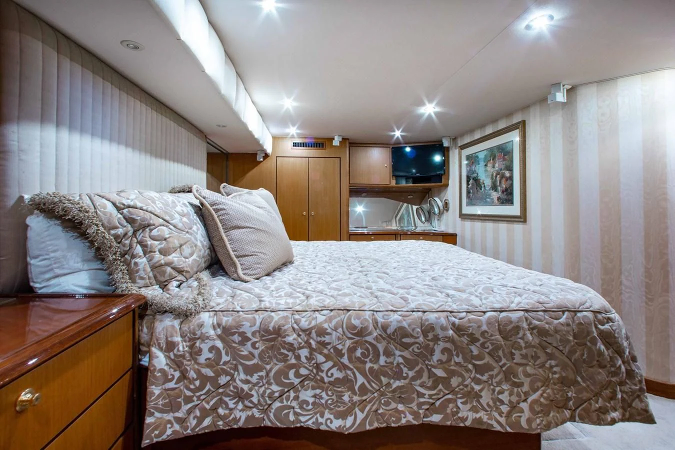 a bed with white sheets aboard ONE MORE TIME Yacht for Sale