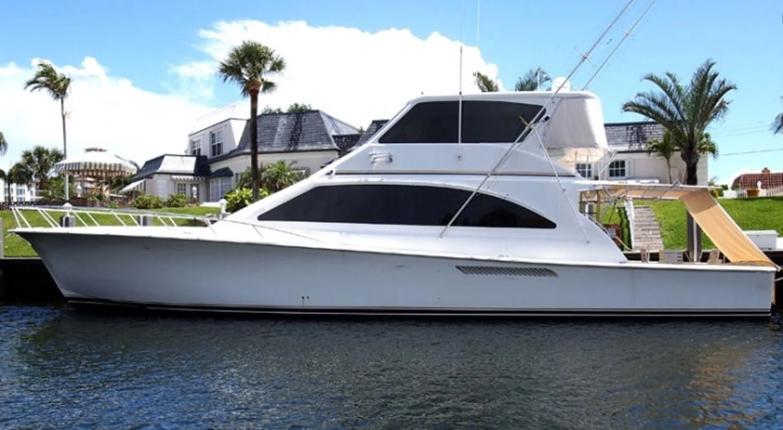 a white yacht on a blue water aboard ONE MORE TIME Yacht for Sale