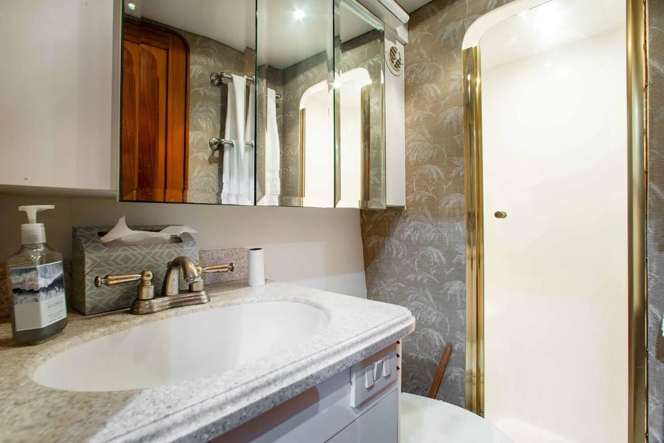 a bathroom with a sink and a mirror aboard ONE MORE TIME Yacht for Sale