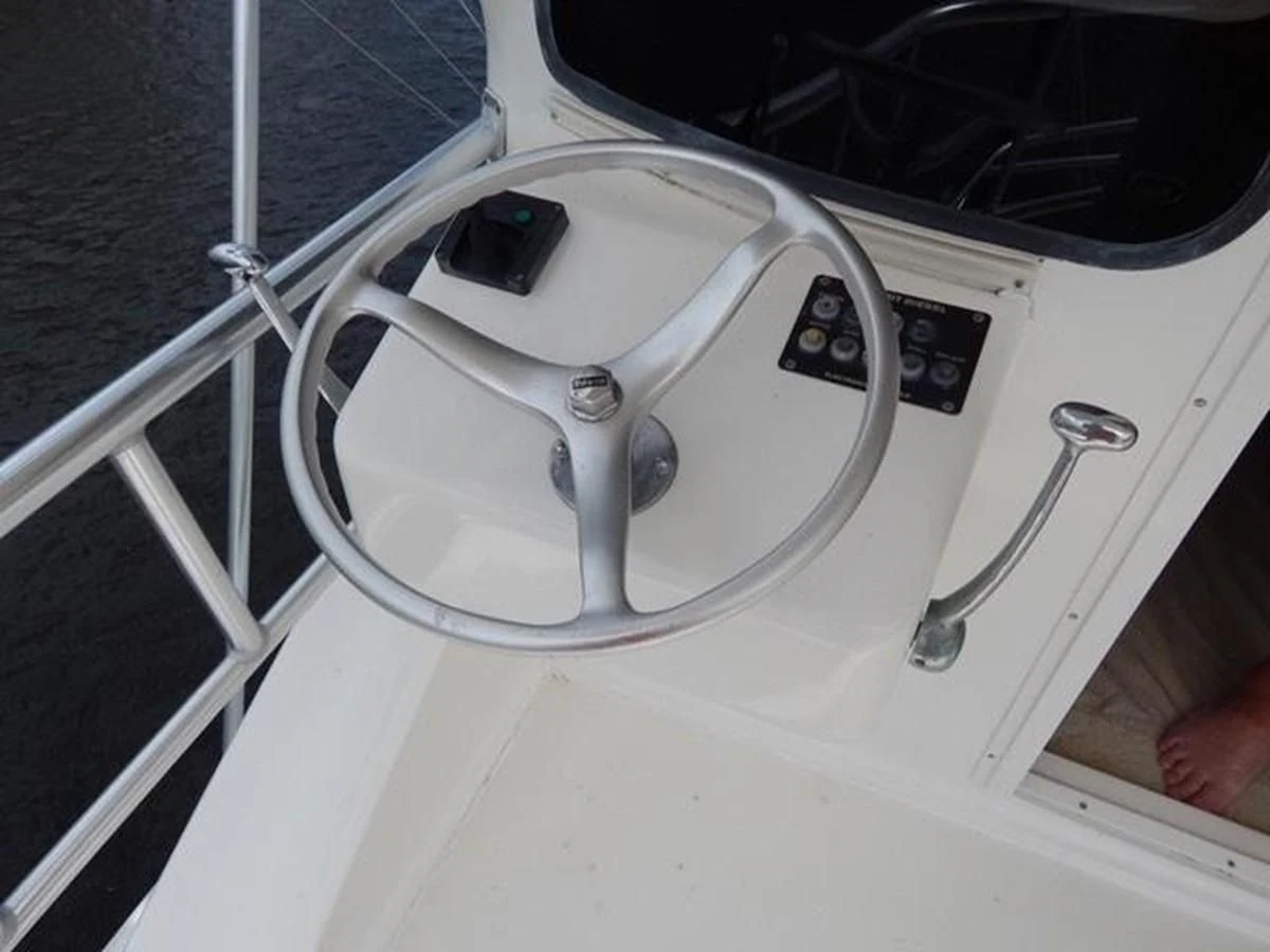 a white rectangular object with a black circle on it aboard ONE MORE TIME Yacht for Sale
