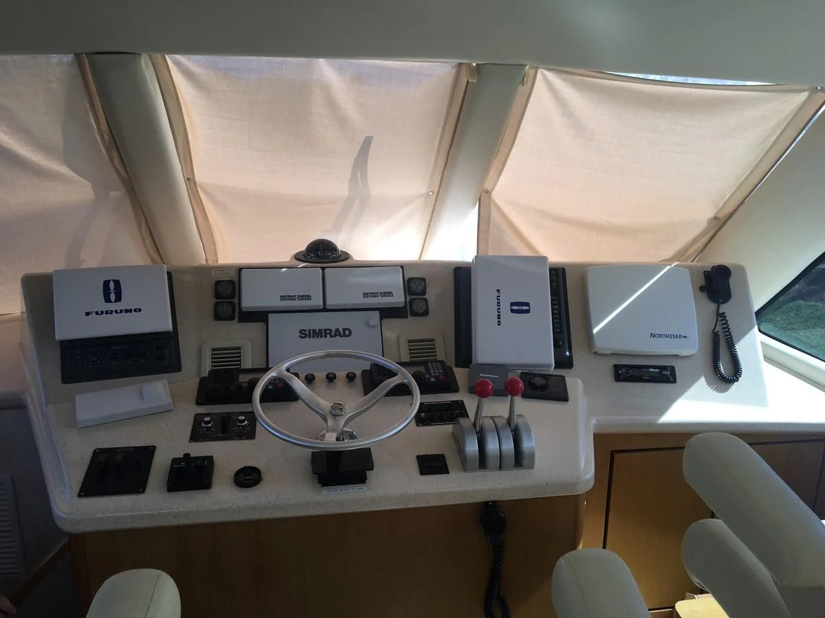 a white table with a fan and electronics on it aboard ONE MORE TIME Yacht for Sale