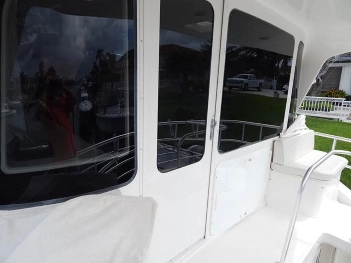 a window with a person in it aboard ONE MORE TIME Yacht for Sale
