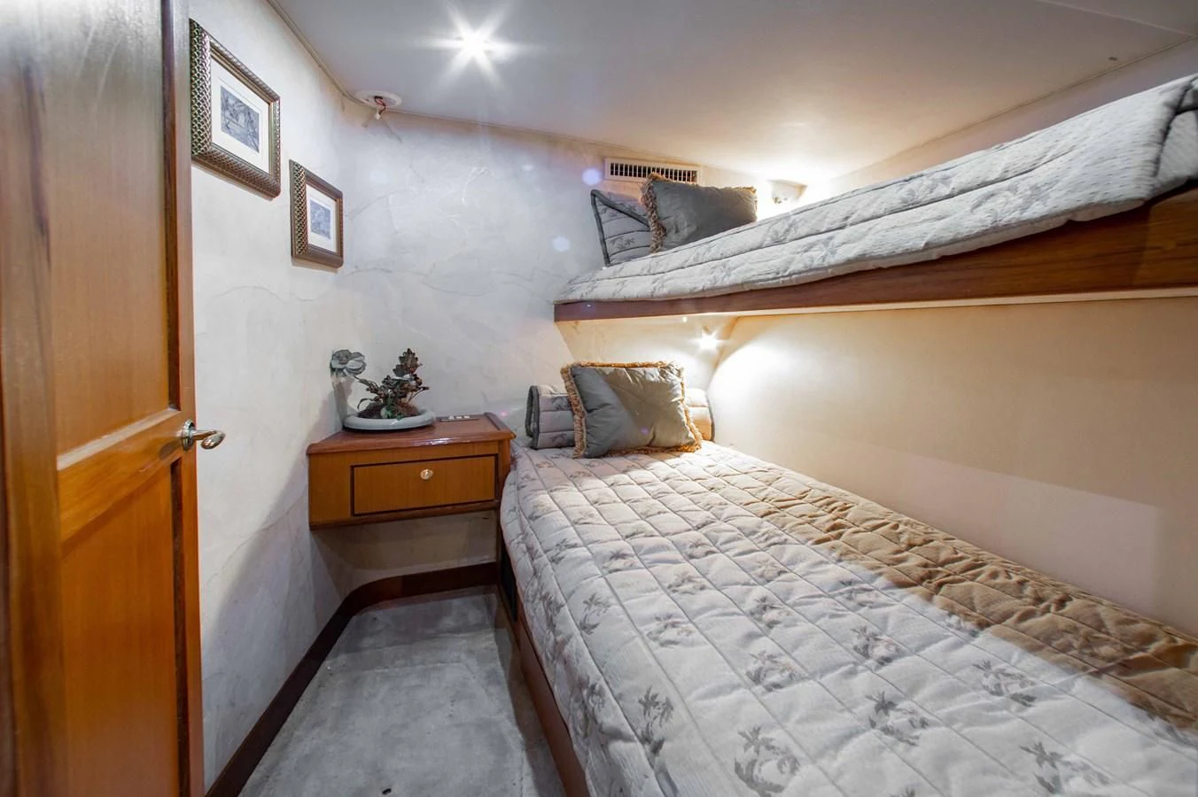 a bedroom with two beds aboard ONE MORE TIME Yacht for Sale