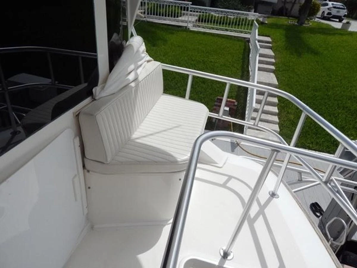a white chair on a balcony aboard ONE MORE TIME Yacht for Sale