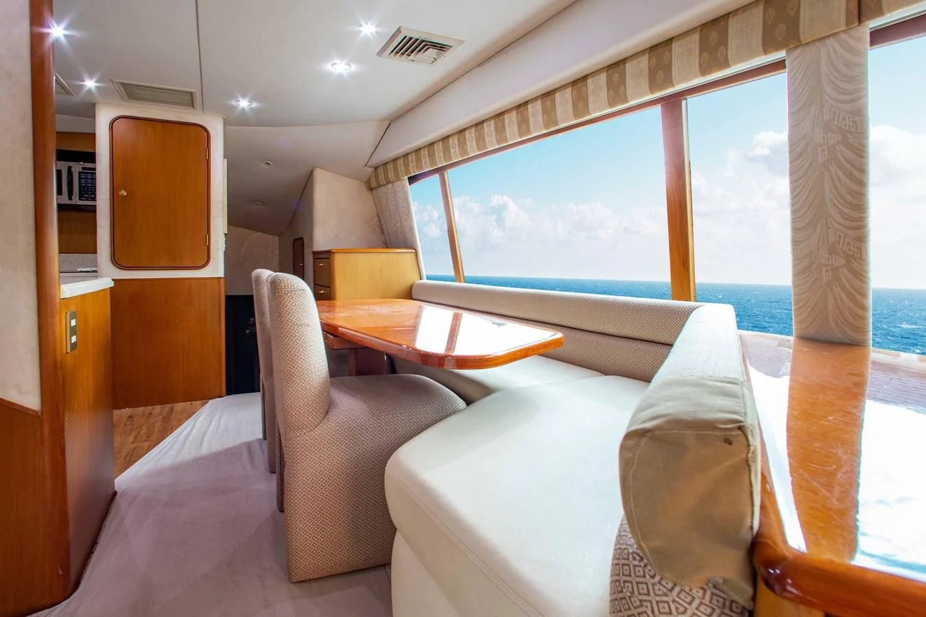 a room with a view of the ocean and the ocean aboard ONE MORE TIME Yacht for Sale