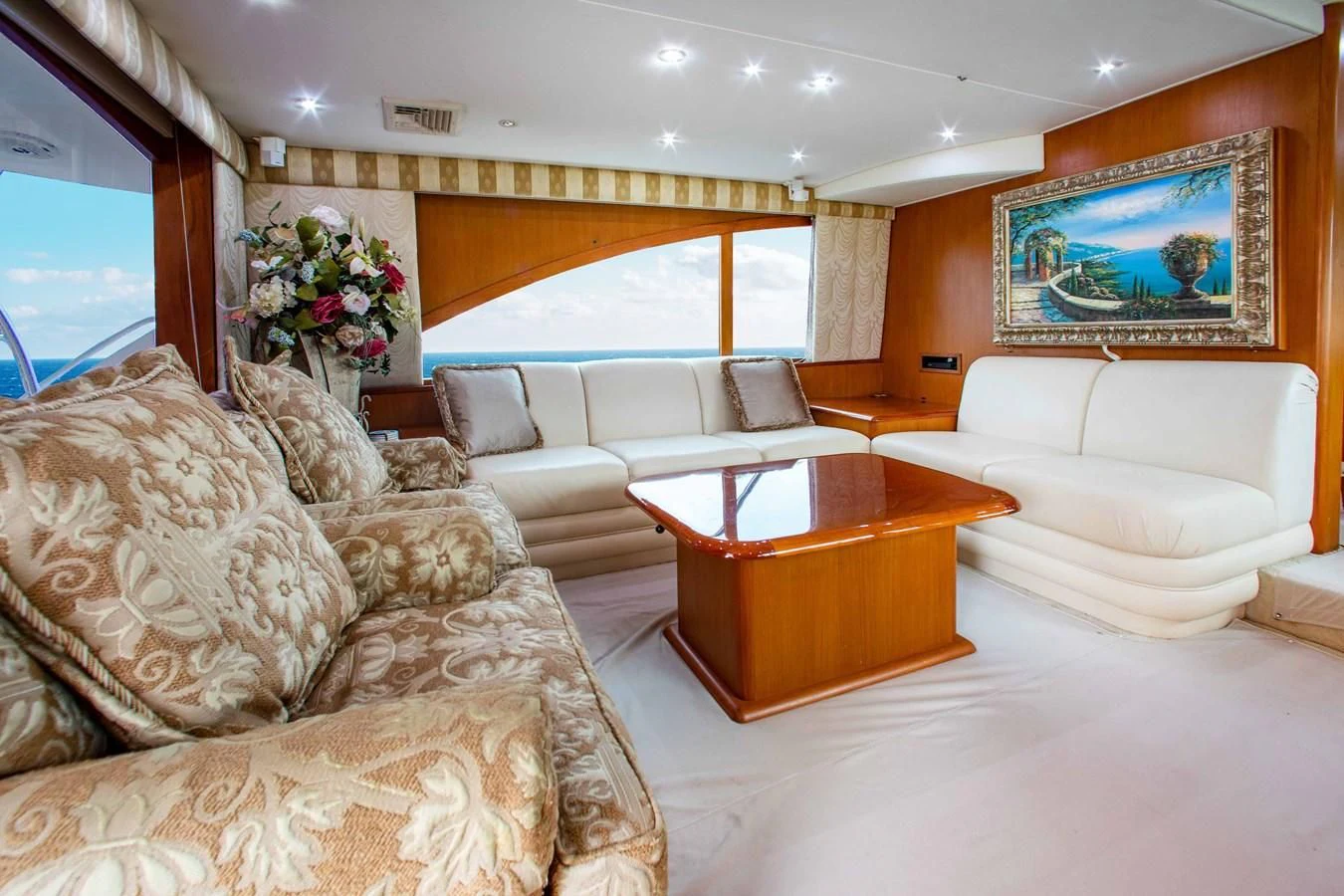 a living room with a couch and a table aboard ONE MORE TIME Yacht for Sale