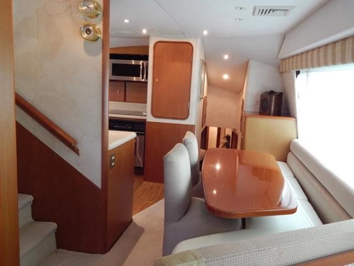 a room with a chair and a table aboard ONE MORE TIME Yacht for Sale