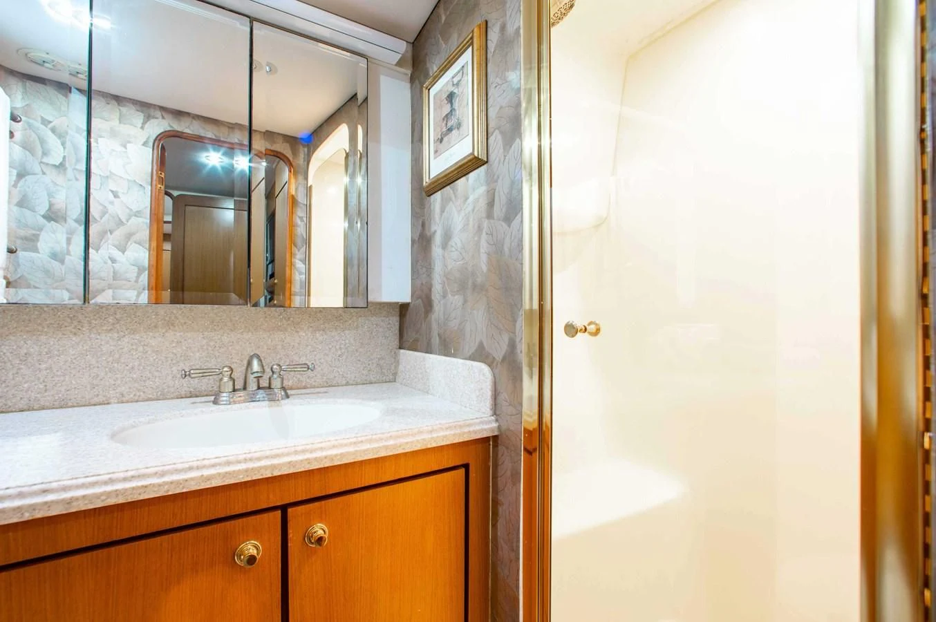 a bathroom with a sink and a mirror aboard ONE MORE TIME Yacht for Sale