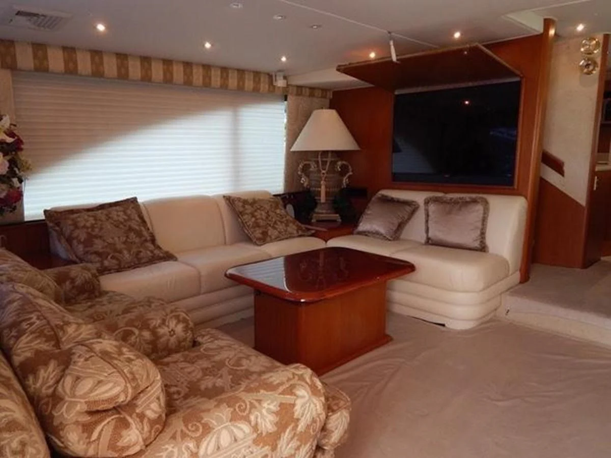 a living room with a couch and a table aboard ONE MORE TIME Yacht for Sale