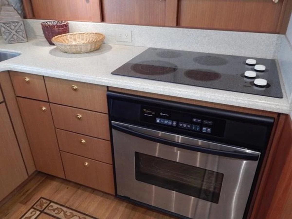 a kitchen with a stove and oven aboard ONE MORE TIME Yacht for Sale
