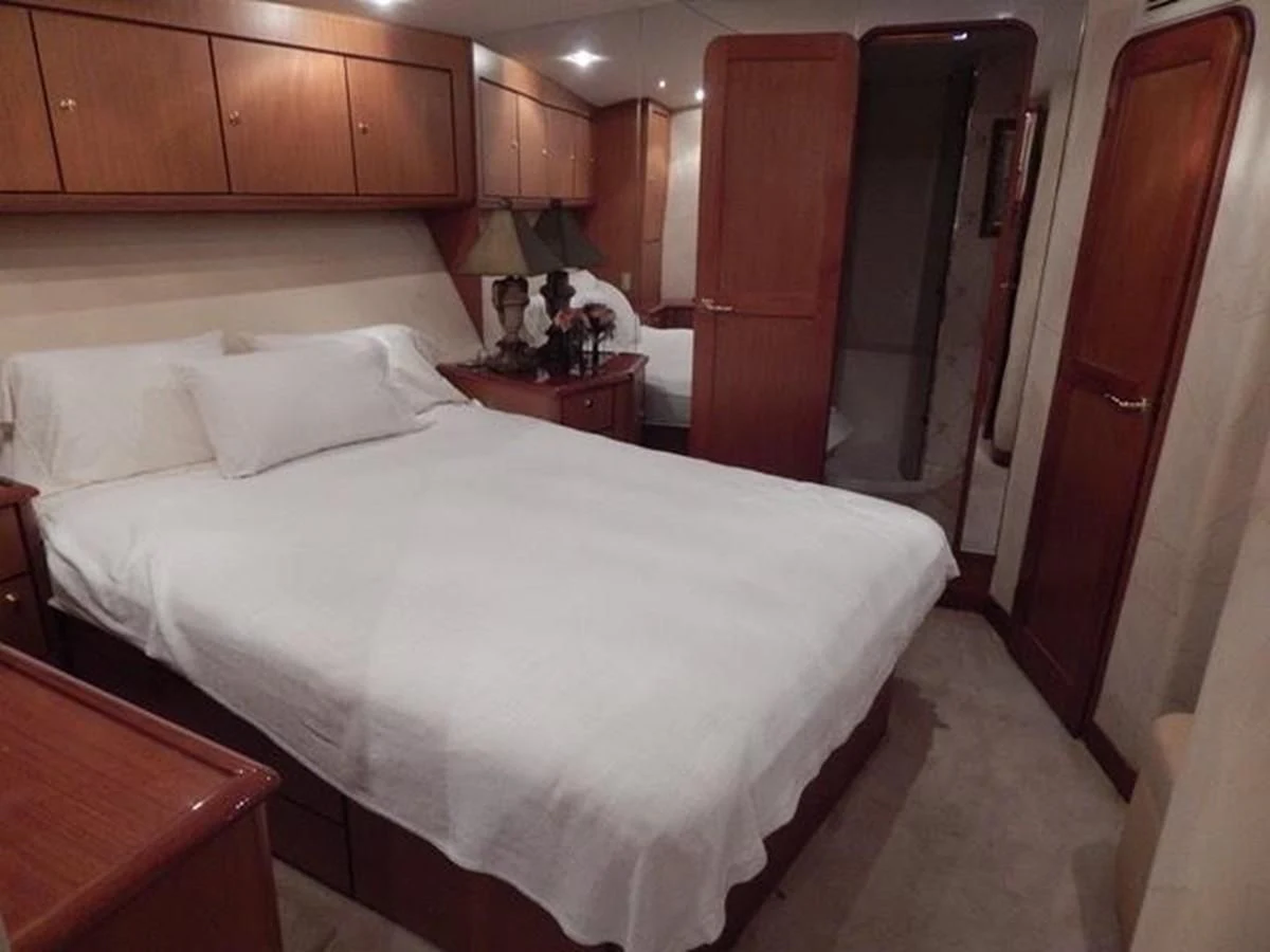 a bed in a room aboard ONE MORE TIME Yacht for Sale