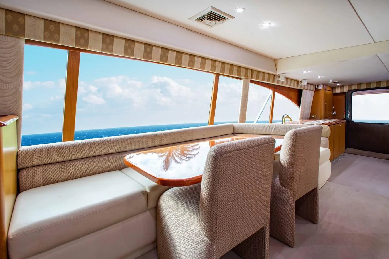 a room with a table and chairs aboard ONE MORE TIME Yacht for Sale