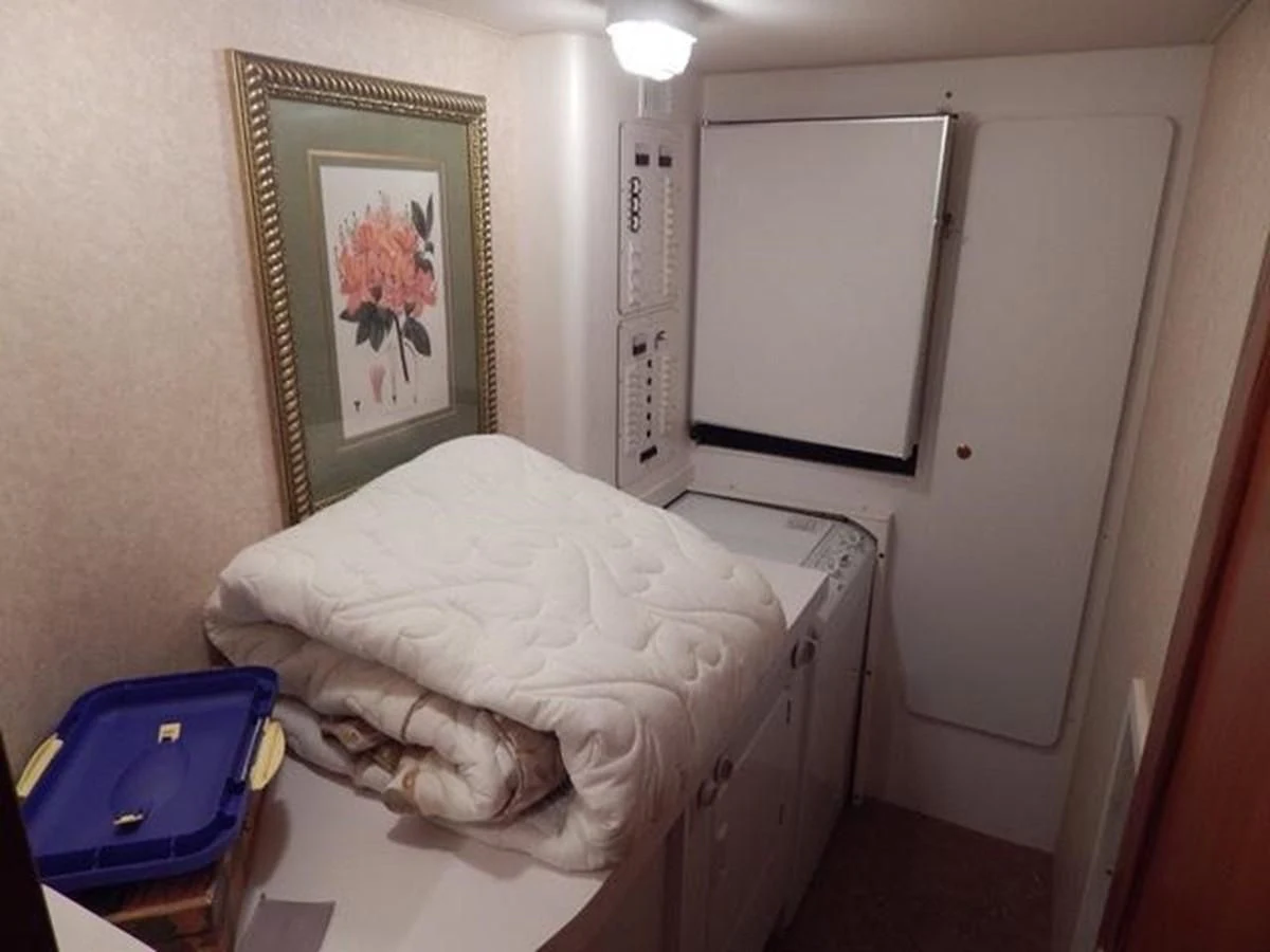 a bed in a room aboard ONE MORE TIME Yacht for Sale