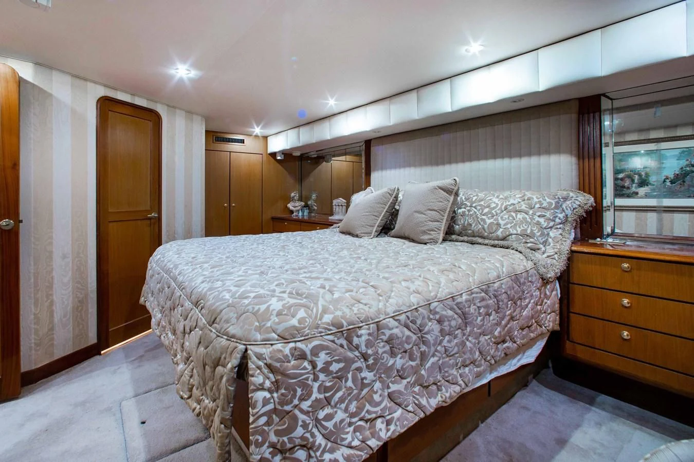 a bed with white sheets aboard ONE MORE TIME Yacht for Sale