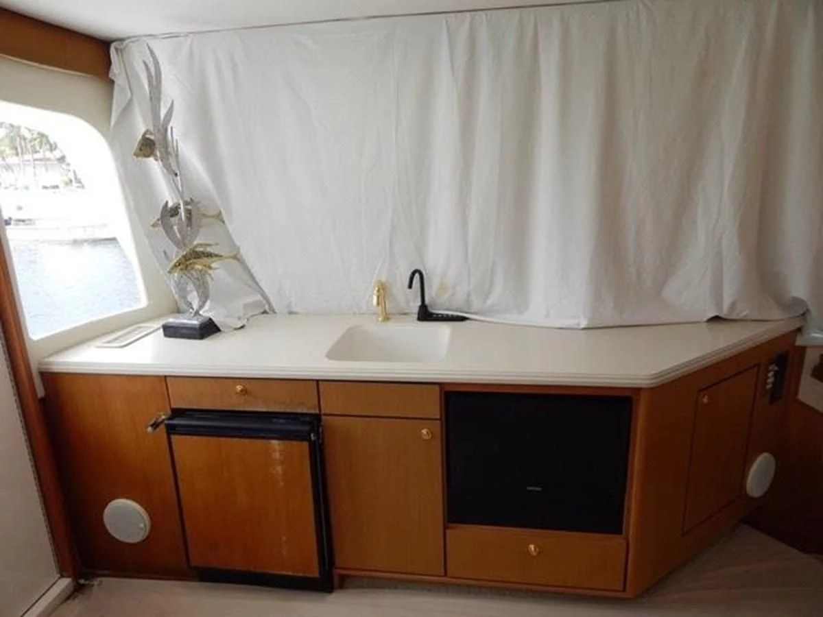 a bathroom with a sink and cabinets aboard ONE MORE TIME Yacht for Sale
