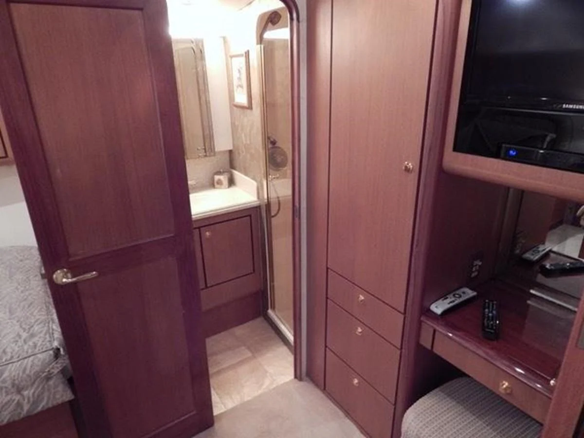 a bathroom with a red door aboard ONE MORE TIME Yacht for Sale