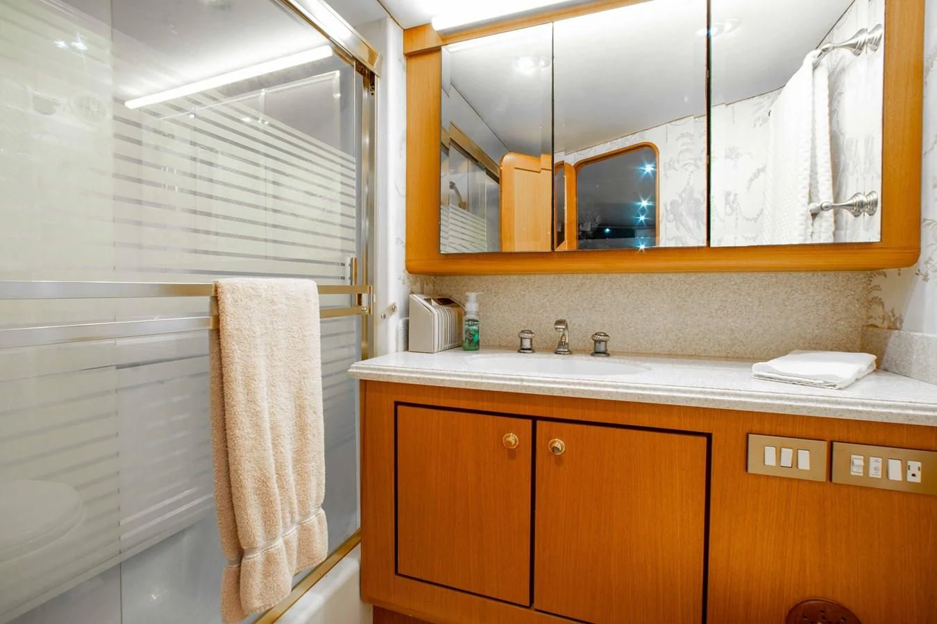 a bathroom with a sink and cabinets aboard ONE MORE TIME Yacht for Sale