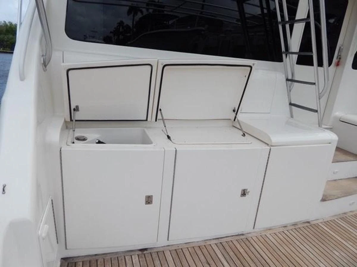 a white vehicle with a large screen aboard ONE MORE TIME Yacht for Sale