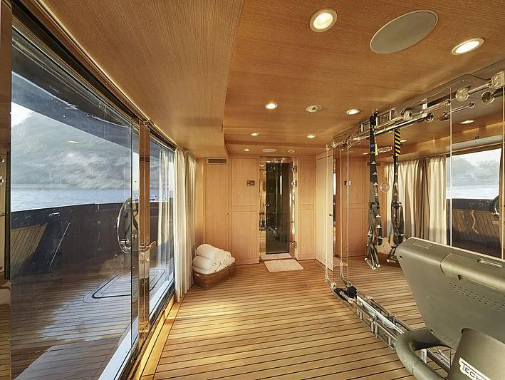 a large room with a wood floor and a large window aboard FORWIN Yacht for Sale