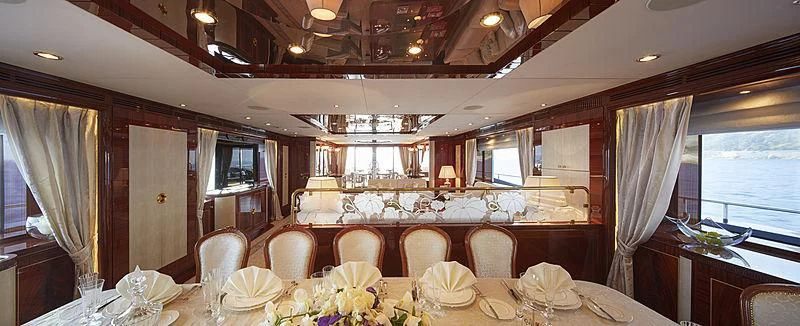 a dining room with a table and chairs aboard FORWIN Yacht for Sale