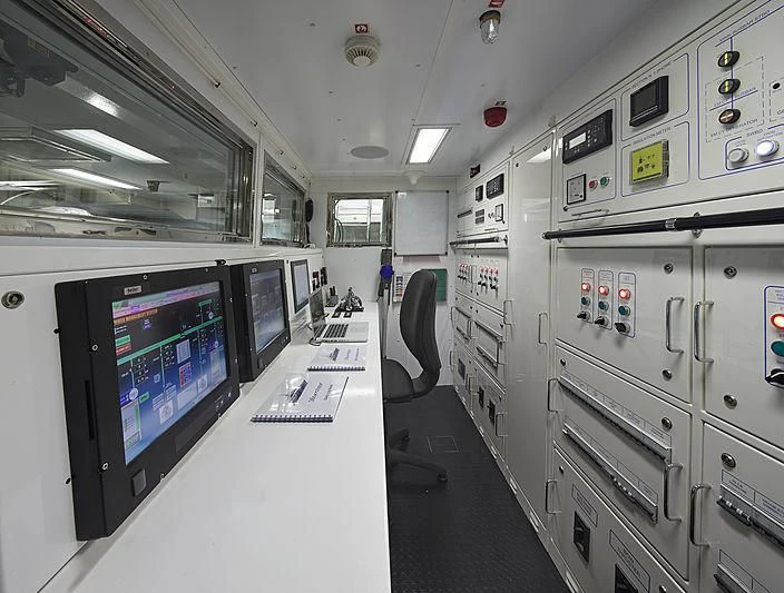 a room with machines and monitors aboard FORWIN Yacht for Sale