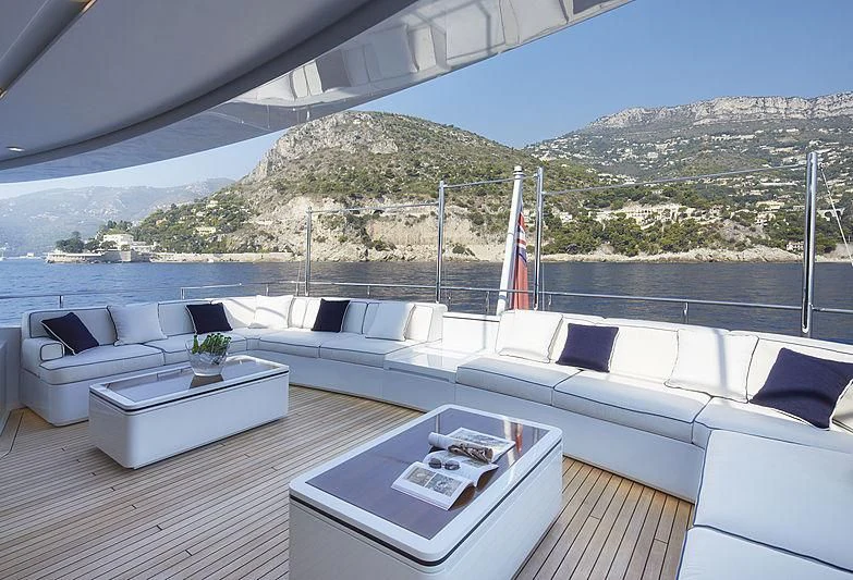 a room with a couch and a table and a flag aboard FORWIN Yacht for Sale